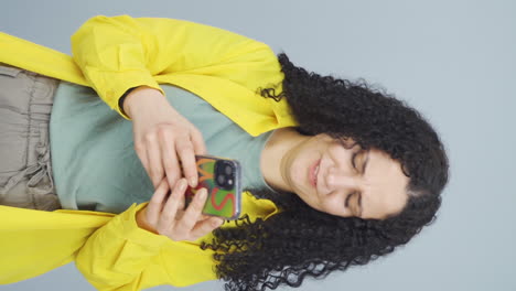 Vertical-video-of-The-young-woman-who-can't-use-the-app-on-the-phone.